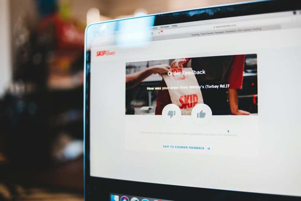 Online survey, Online feedback form interface on laptop screen illustrating user interaction with delivery service.