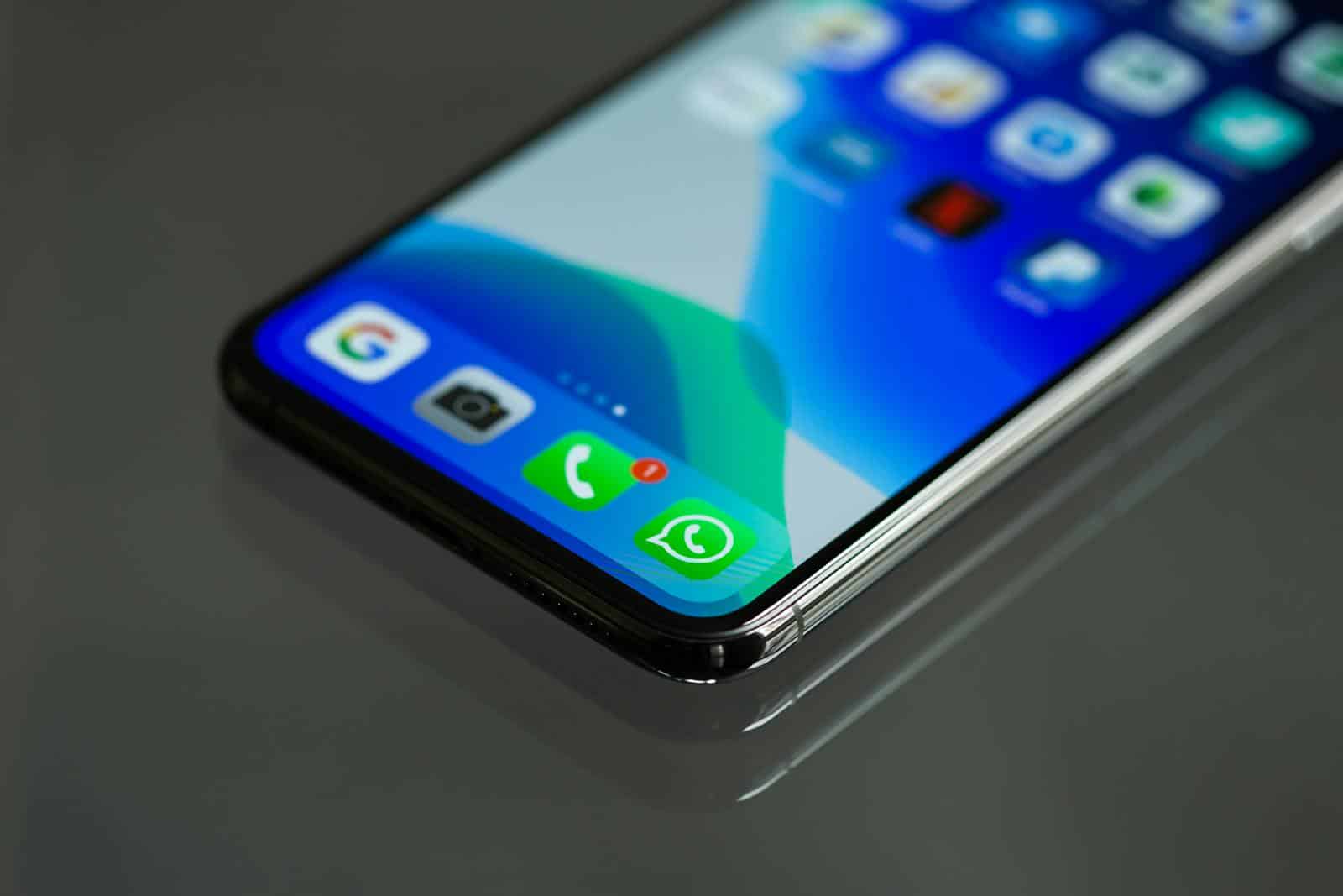 Whatsapp Business, Close-up shot of a smartphone screen displaying various app icons including WhatsApp.