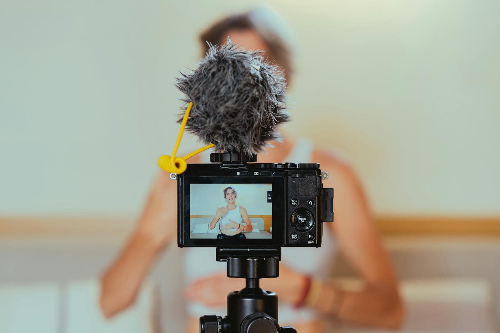 Website, traffic, SEO, search engine, Elderly woman engages in vlogging using camera and microphone, embracing modern technology.