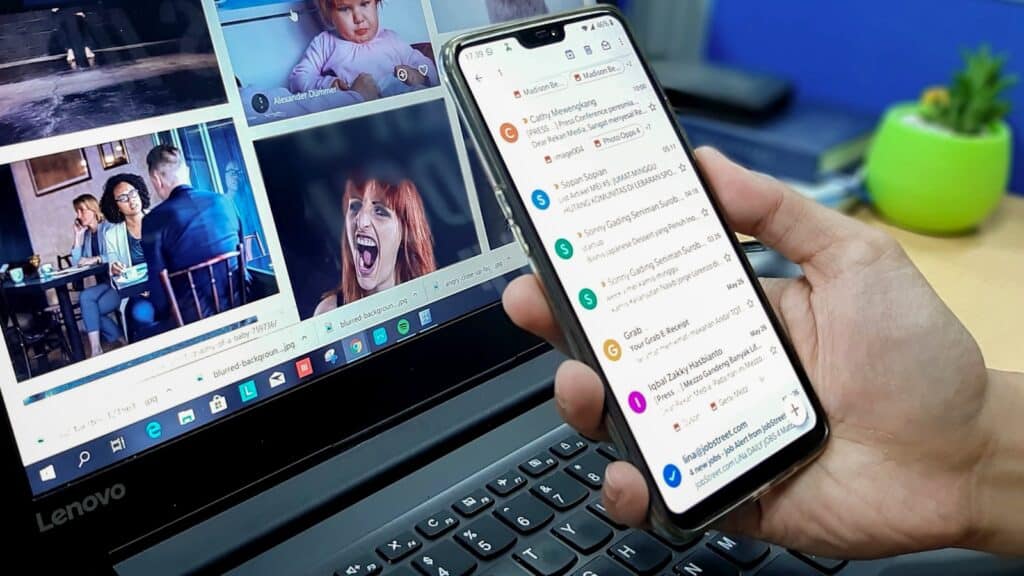 email, marketing, automation, person using smartphone and laptop computer