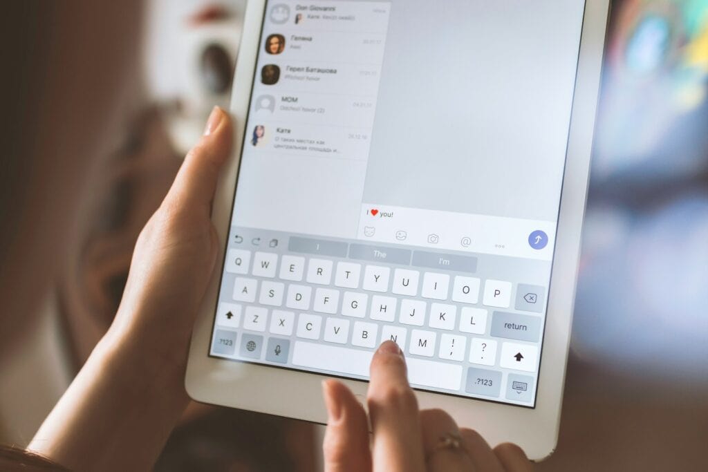 Content Moderation, person using white iPad