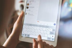 Content Moderation, person using white iPad