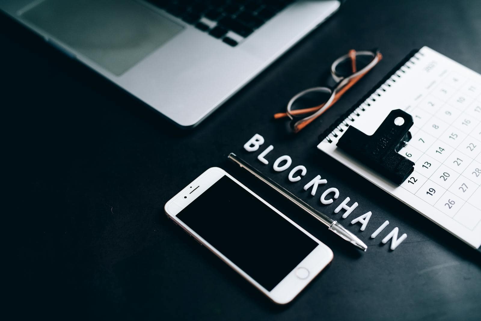 Decentralization, blockchain, cryptocurrency, exchange, valr, bitcoin, btc, Flat lay of a modern digital workspace with blockchain theme, featuring a smartphone and calendar.