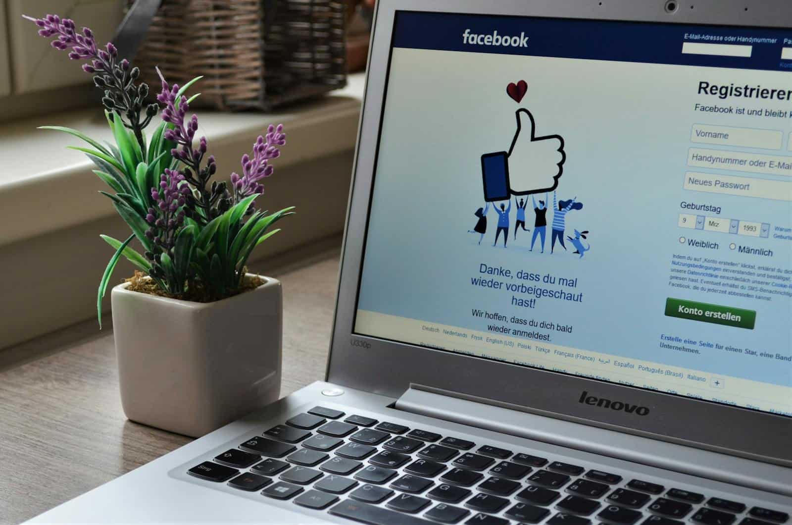 Missing Lettr, Social Media Marketing, Marketing Automation, LinkedIn, X, Twitter, Masterdon, Facebook, Google, Medium, Posts, Engagement, Analytics, Online Advertising, Content Calendar, A Lenovo laptop displaying Facebook login beside a lavender plant indoors.