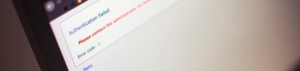 Close-up of a computer screen displaying an authentication failed message.